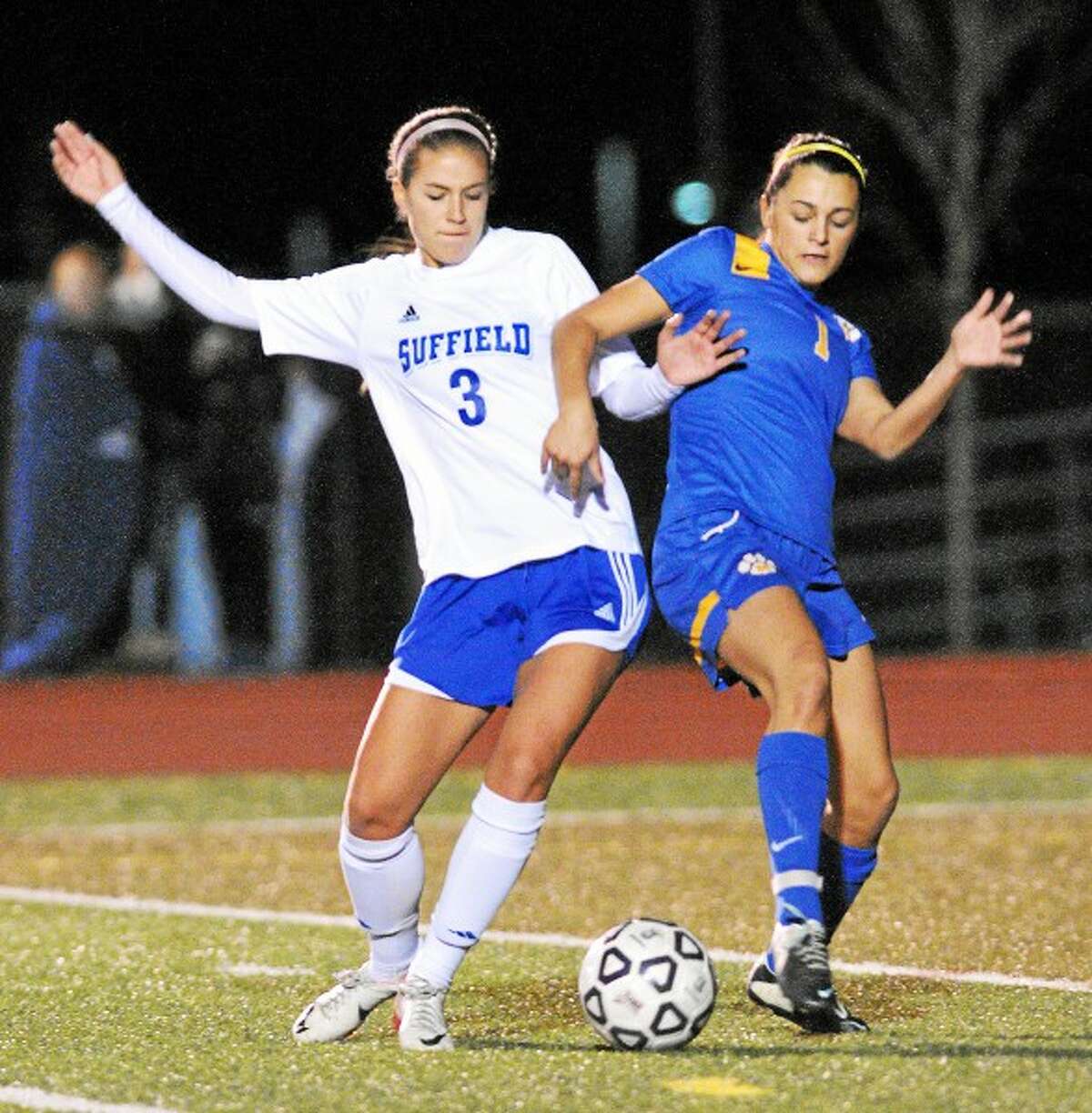 Mercy’s Blakeslee Palmer battles Suffield junior Katie McDonough during the CIAC Class LL semifinal game at Middletown High School Monday afternoon. Mercy lost 3-1. Catherine Avalone – The Middletown Press