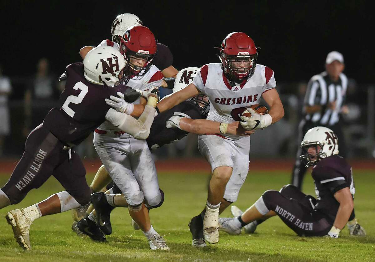 Cheshire senior running back Brian Weyrauch finds an opening during a 24-21 win over North Haven, on opening night of high school football, Friday, September 9, 2016, at Mike Vanacore Field at the North Haven Athletic Complex.