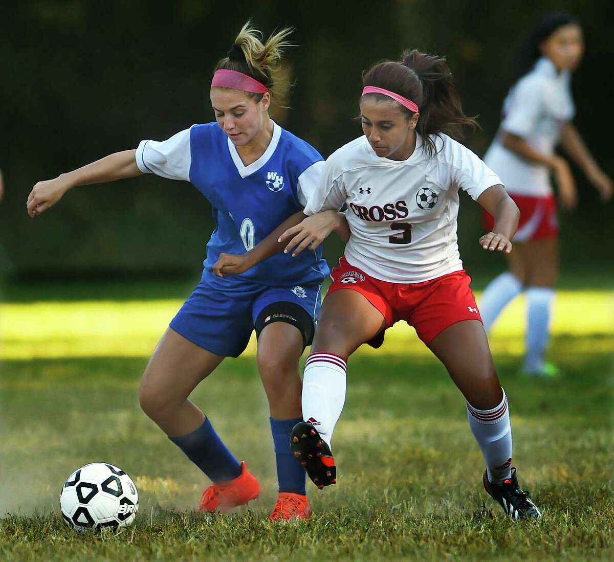 West Haven’s Gabriella Prisco battles Wilbur Cross’ Angelica Rodriguez, Tuesday, September 13, 2016, in a 5-2 win for the Blue Devils at Rice Field at East Rock Park in New Haven. (Catherine Avalone/New Haven Register)