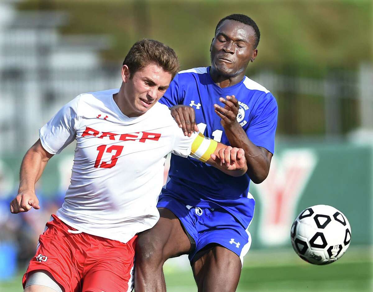 Fairfield Prep senior defender Biagio Paoletta battles West Haven junior midfielder Wanderson Maia in a 3-2 victory for the Jesuits, Wednesday, September 21, 2016, at Conway Field at Rafferty Stadium at Fairfield University. (Catherine Avalone/New Haven Register) @AvaloneNHR