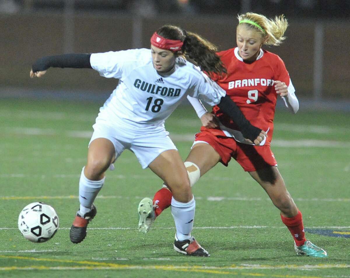Guilford’s Julia Carr (left) and Branford’s Shyla Coughlin battle for the ball during the SCC championship. The two girls soccer rivals will face for the Class L title Saturday at 2 p.m. at West Haven.