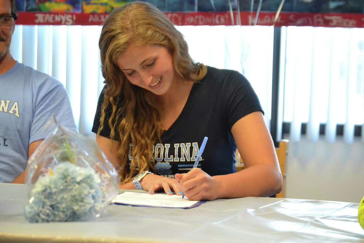 Torrington’s Sydney Matzko signed her national letter of intent to play softball at the University of North Carolina on Friday in the library at Torrington high school in front of her parents, administrators, teammates and classmates.