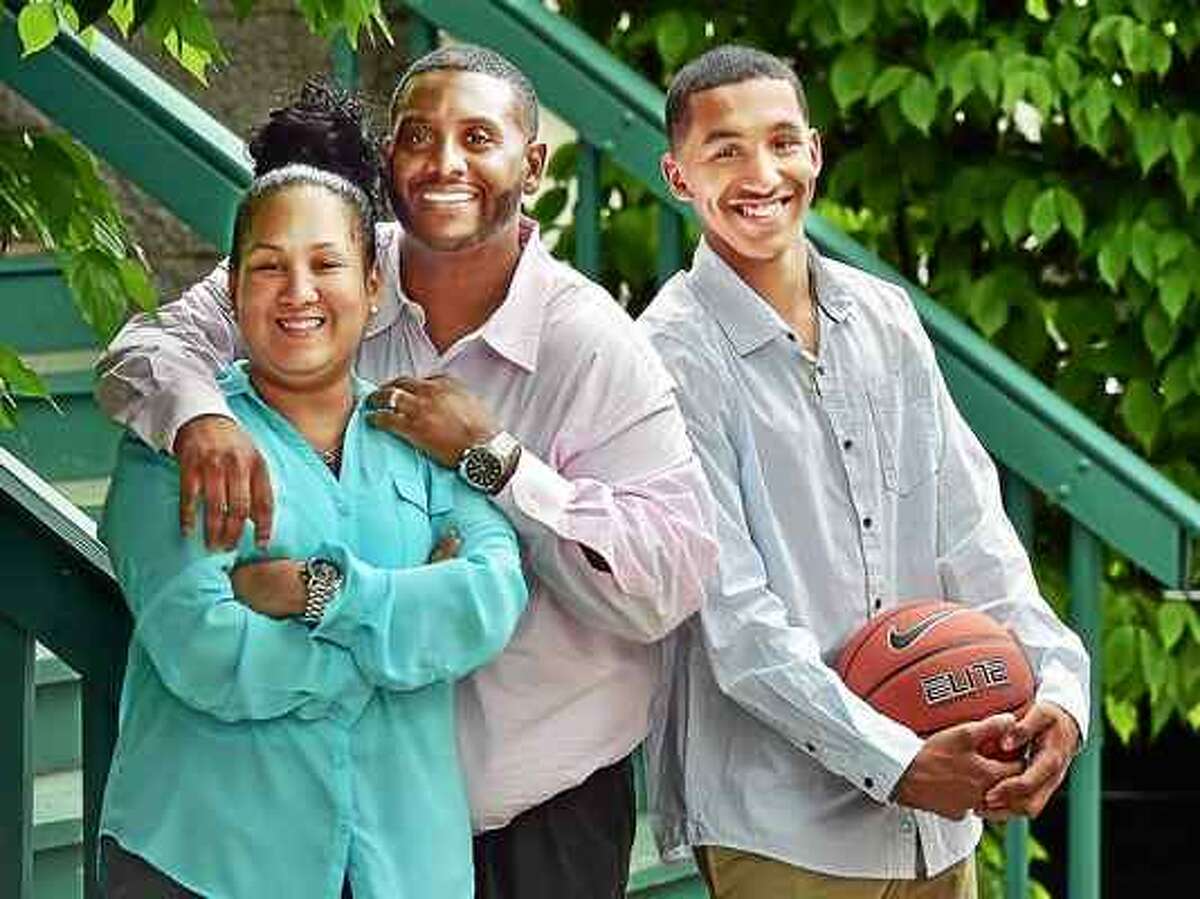 CATHERINE AVALONE — NEW HAVEN REGISTER From left to right, Vanessa, Edward and Tremont Waters, 17, of New Haven. Tremont Waters has transferred to Notre Dame-West Haven for his senior season.