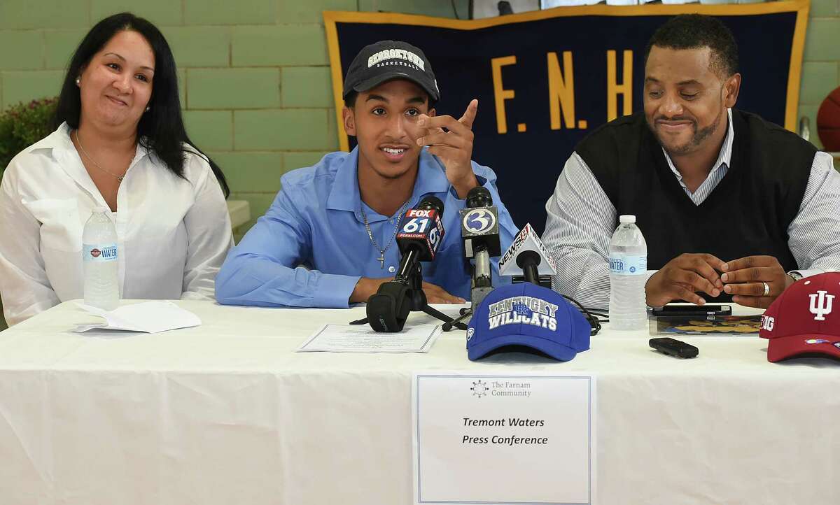 New Haven resident Tremont Waters, a senior point guard at Notre Dame High School with his parents, Vanessa and Edward Waters, makes a verbal committment to play Division 1 college basketball at Georgetown University, Wednesday, October 19, 2016, at the Farnam House at 162 Fillmore Street in New Haven where Tremont grew up playing basketball. (Catherine Avalone/New Haven Register)