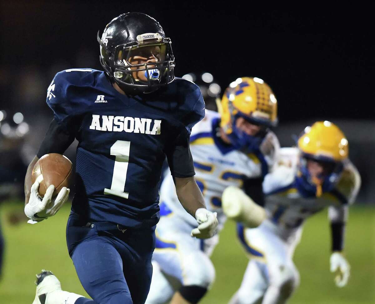 Ansonia running back Markell Dobbs runs for a touchdown against Seymour, in a 41-20 win for the Chargers, Friday, October 28, 2016, at Jarvis Stadium in Ansonia. (Catherine Avalone/New Haven Register)