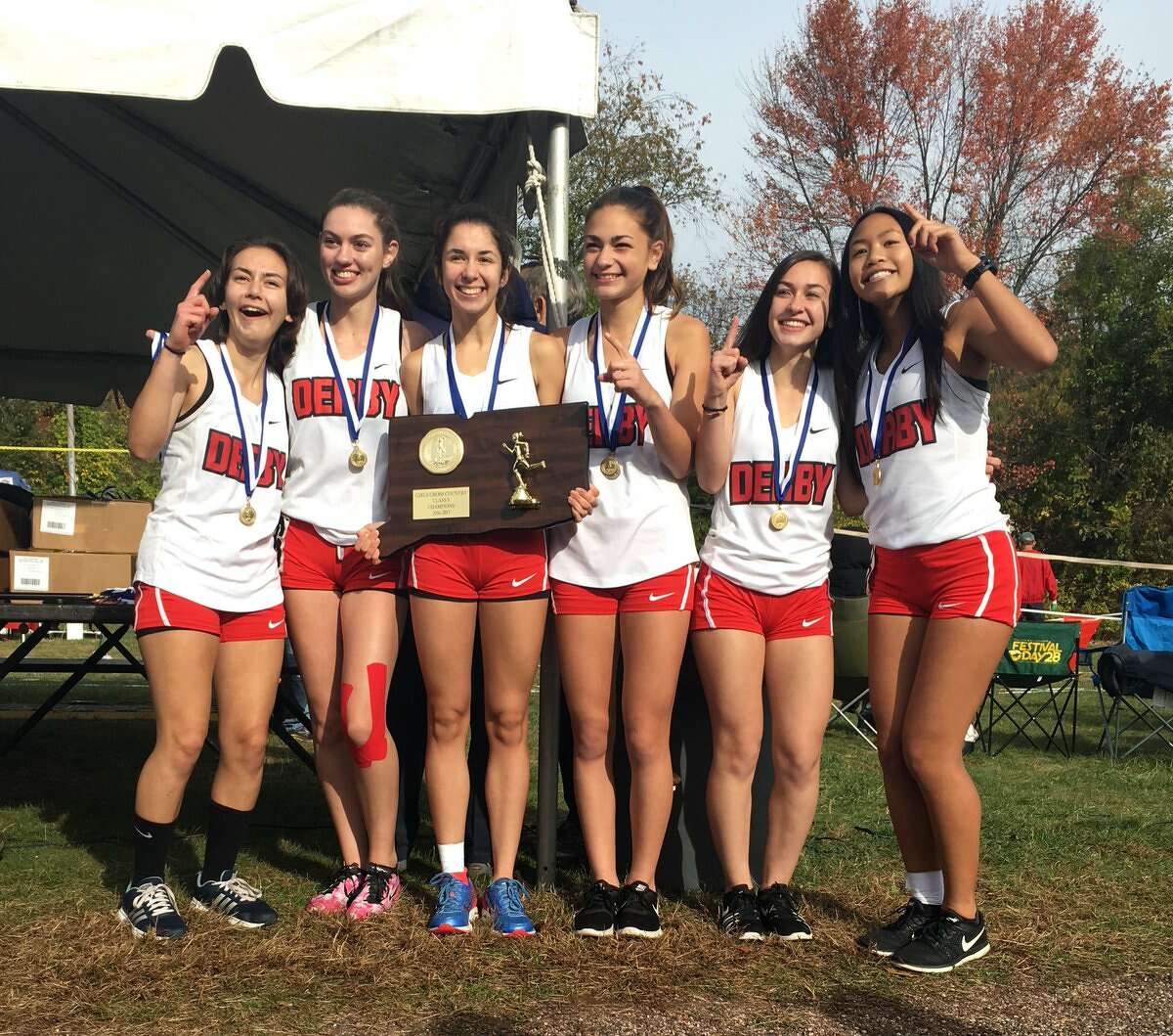 Derby’s girls cross country team celebrates its first girls state title since 1985 (Photo via Jenny Ames)