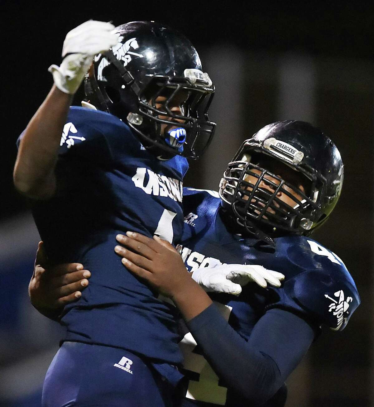 Ansonia’s Markell Dobbs celebrates one of his touchdowns against Valley rival Seymour on Friday. (Catherine Avalone/New Haven Register)