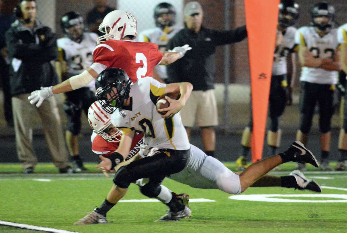 Amity’s Luke Smith tries to avoid a tackle during his team’s 1-point loss to Branford