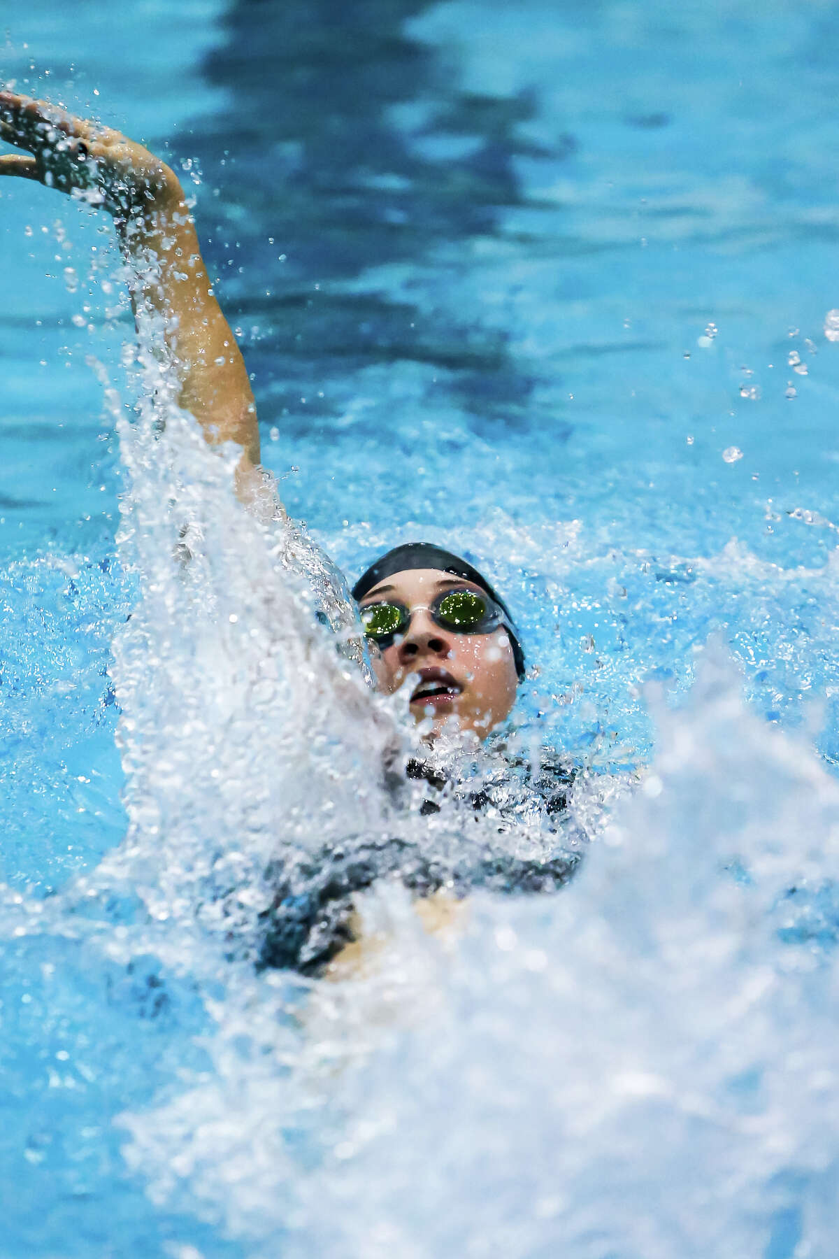 Amity’s Molly Cox competes in the Backstroke leg of the 200 yard IM during th SCC Swim Champiosnhp Thrusday evening at SCSU.-John Vanacore/New Haven Register