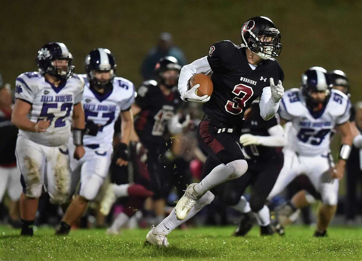 Valley Regional/Old Lyme senior Garret Burdick runs for for a 99-yard touchdown on an interception return in the third quarter in a 45-0 win over the North Branford, Friday, October 14 2016. (Catherine Avalone/New Haven Register)