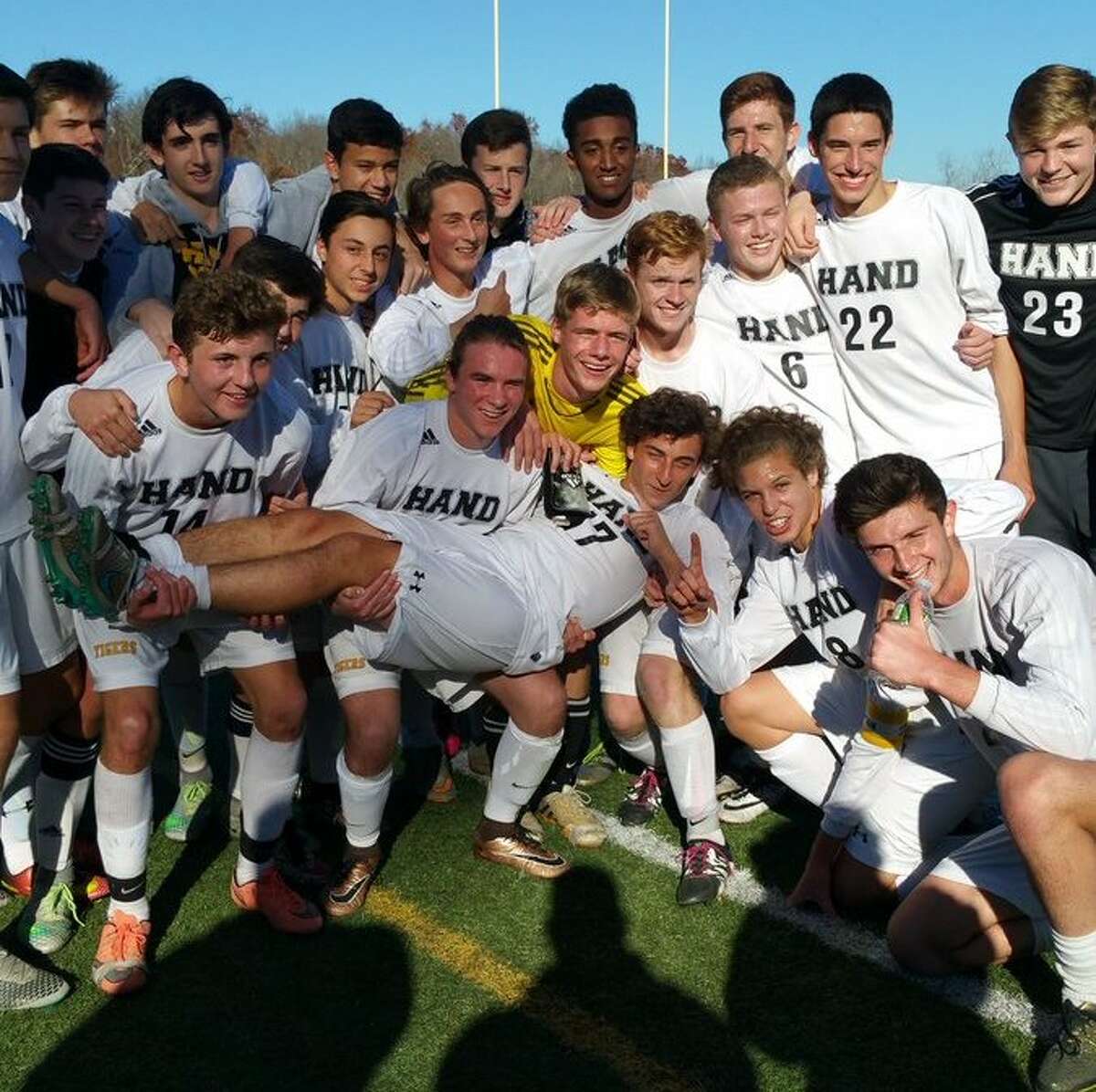 Hand’s boys soccer team celebrates its 1-0 Class L boys soccer victory over Barlow. (Photo via Hand High School)