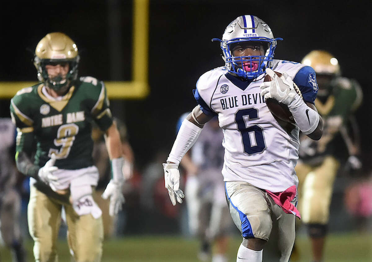 West Haven running back Anthony Godfrey runs for 78 yards to score a touchdown against Notre Dame (WH) in the third period, defeating the Green Knights, 36-13, Friday night, October 21, 2016, at Veterans Memorial Field in West Haven. (Catherine Avalone/New Haven Register)