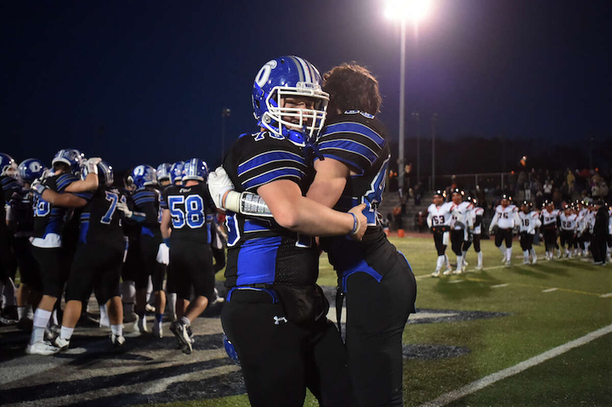 Darien celebrates their back to back win in the Class LL championship over Ridgefield, 28-7, Saturday, December 10, 2016, at Ken Strong Stadium at West Haven High School. (Catherine Avalone/New Haven Register)