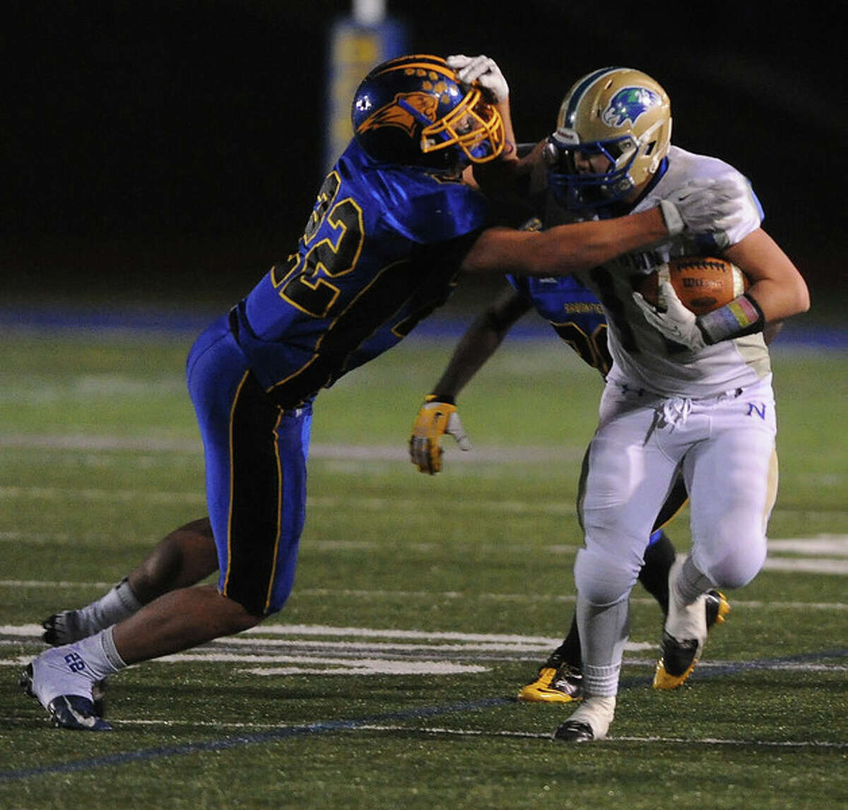 MVP Cooper Gold of Newtown tries to escape the grasp of Brookfield’s Liam Clancy in the SWC title game. (Photo Mara Lavitt)