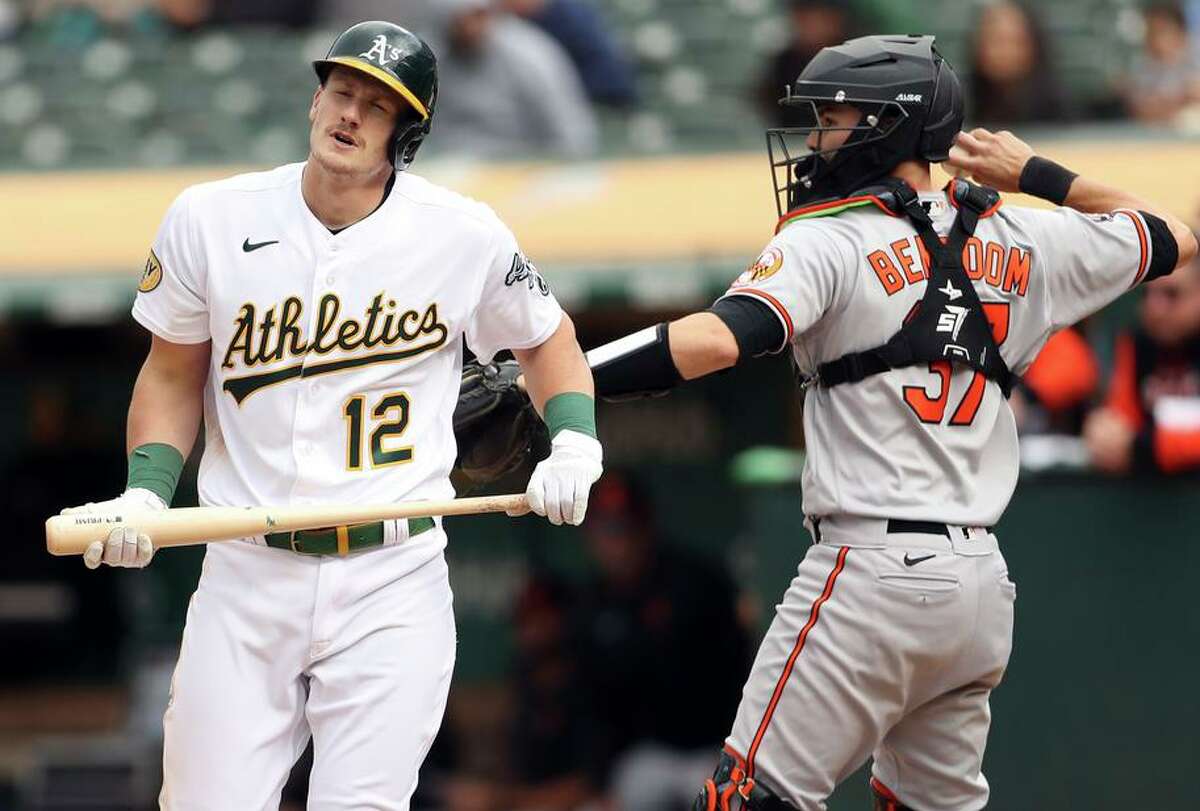 Sean Murphy reacts to a strikeout with two runners on in the eighth. The A’s went 0-for-7 with runners in scoring position.