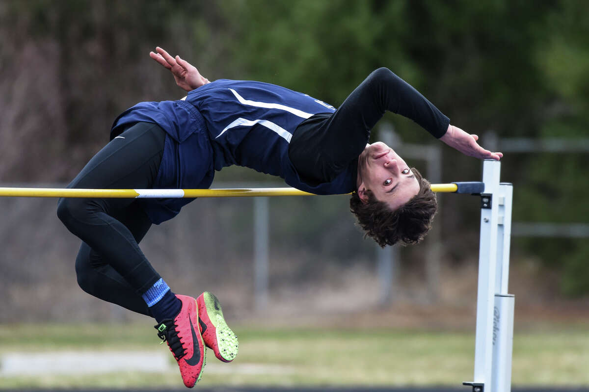 Meridian High's Logan Crowder competes in the high jump during a track meet against Clare High School Wednesday, April 20, 2022 at Meridian Early College High School.