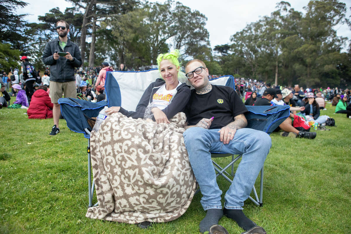 (Left to right) Amber Gonzales and Allyn Bell chill out while listening to the music at the 420 Hippie Hill event in Golden Gate Park in San Francisco, Calif. on April 20, 2022.
