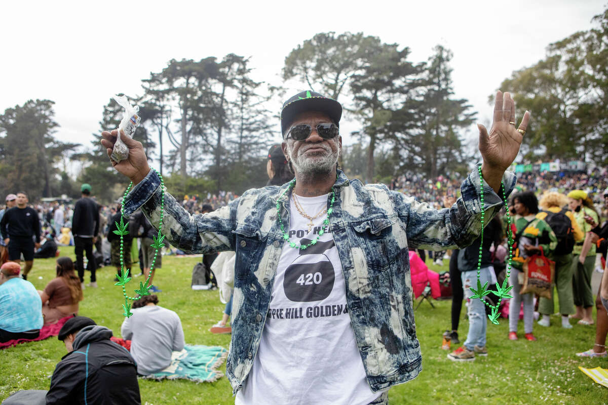 A vendor holds some of the items he has for sale at the 420 Hippie Hill event in Golden Gate Park in San Francisco, Calif.  on April 20, 2022.