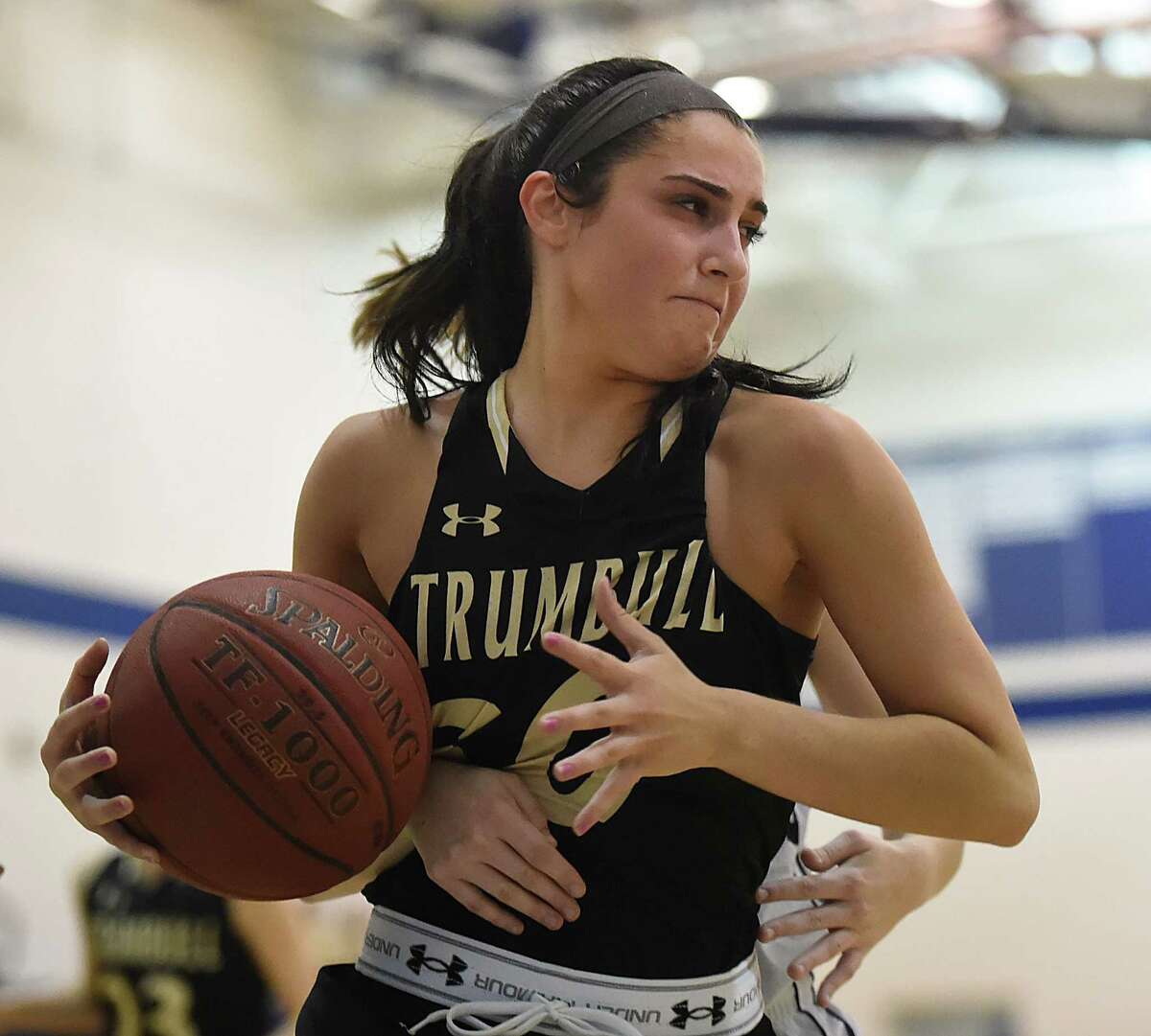 Trumbull’s Victoria Ray tries to wrest herself from an opponent during a victory over Lauralton Hall in January. Following New London’s loss to Career, the unbeaten Eagles assumed the No. 1 spot in the latest GameTimeCT / Register Top 10. (Catherine Avalone/New Haven Register)