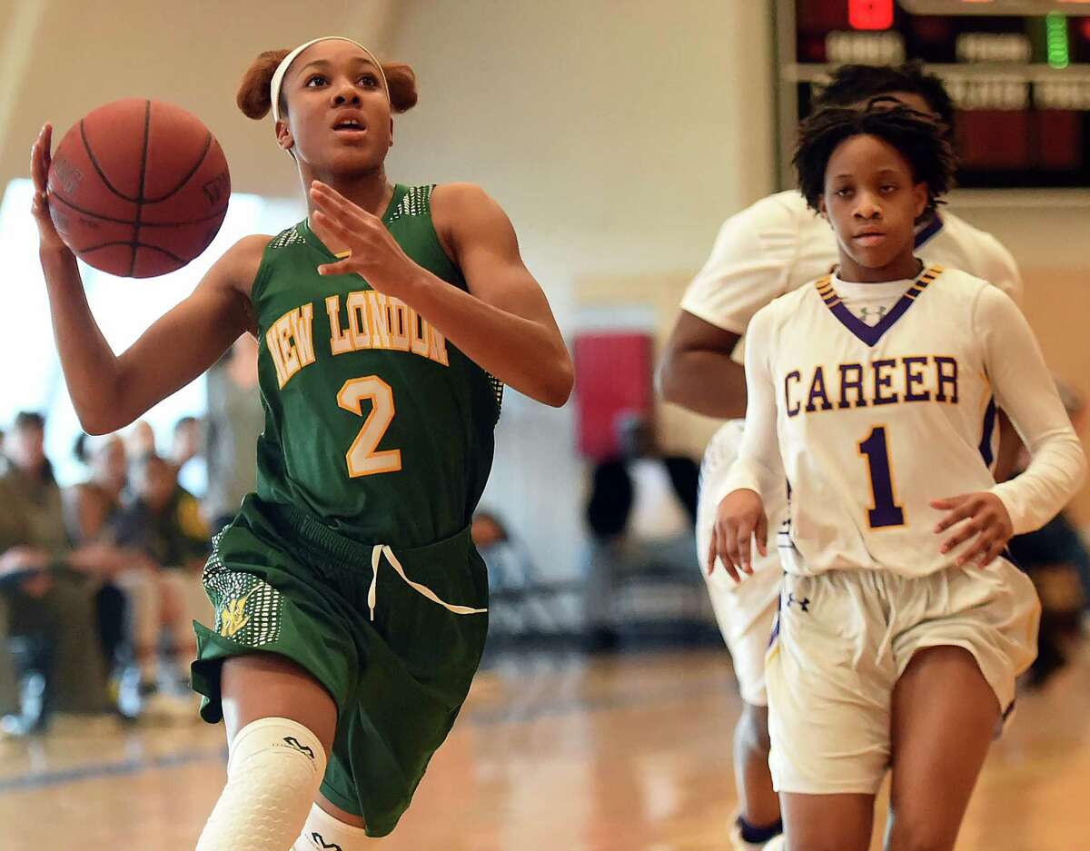 New London’s Rosalee Nicholson races in for a layup vs. Career on Feb. 4. The Whalers regained the No. 1 ranking they lost from that game. (Catherine Avalone/New Haven Register)
