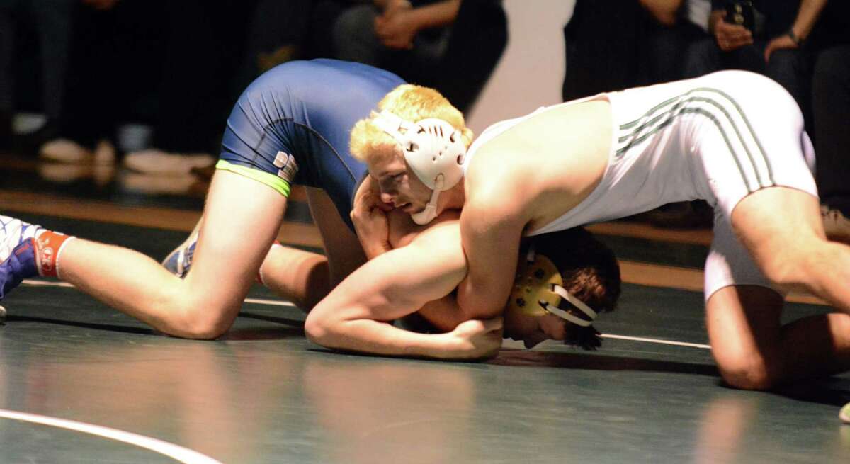 Avon wrestling claims Class M crown; Killingly wins Class S title