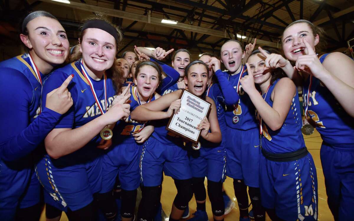 The Mercy Tigers celebrate following their 49-39 victory over Daniel Hand in the SCC championship game, Wednesday, February 22, 2017, at the Edna L. Fraser Gymnasium at East Haven High School. (Catherine Avalone/New Haven Register)