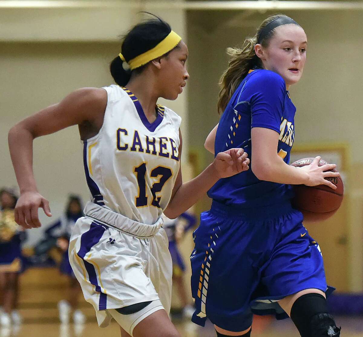 Mercy’s Bella Santoro looks to pass as Career’s Ciara Little defends in a 53-50 win for the Tigers Tuesday, February 7, 2017, at the gymnasium at Hill Regional Career High School in New Haven. (Catherine Avalone/New Haven Register)