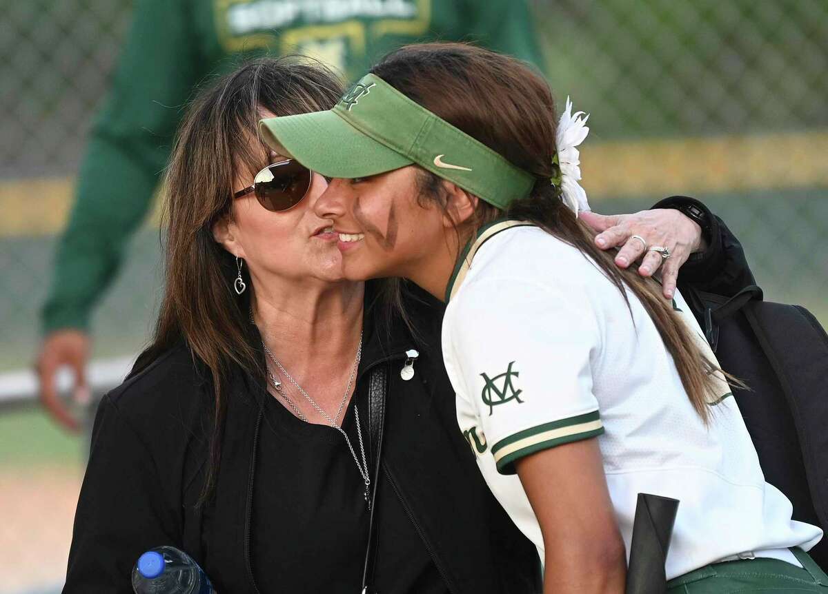 Lisa Johns hugs her great niece, Dom Guerrero (3), after she pitched a 10-0 no-hitter against Floresville on Wednesday, April 20, 2022.