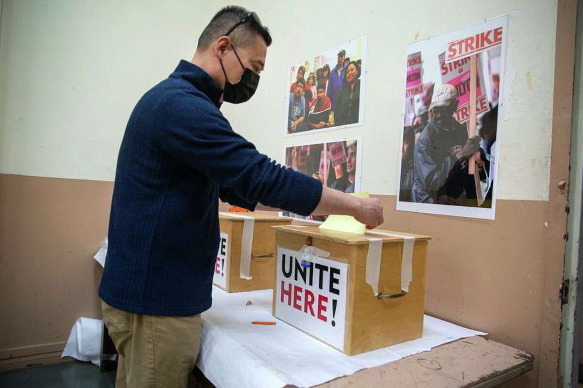 Bill Fung of Daly City, arrives to cast his ballot for the proposed merger of the San Francisco and East Bay chapters of the Unite Here service union.