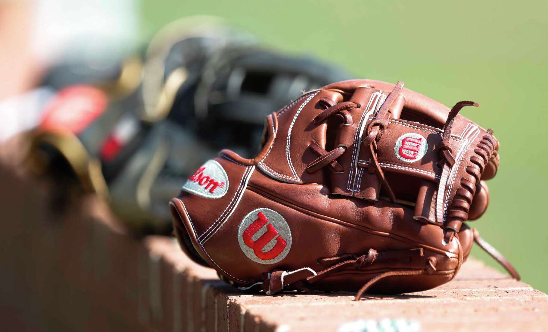 Baseball gloves are seen during the Ferrell Classic at Conroe High School, Thursday, March 3, 2022, in Conroe.