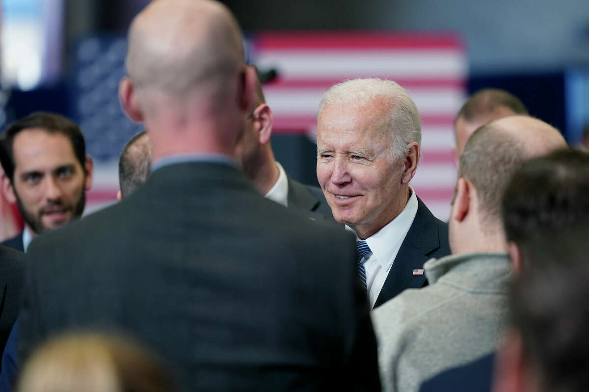 President Joe Biden talks to people in the crowd after speaking about his infrastructure agenda at the New Hampshire Port Authority in Portsmouth, N.H., Tuesday, April 19, 2022. 