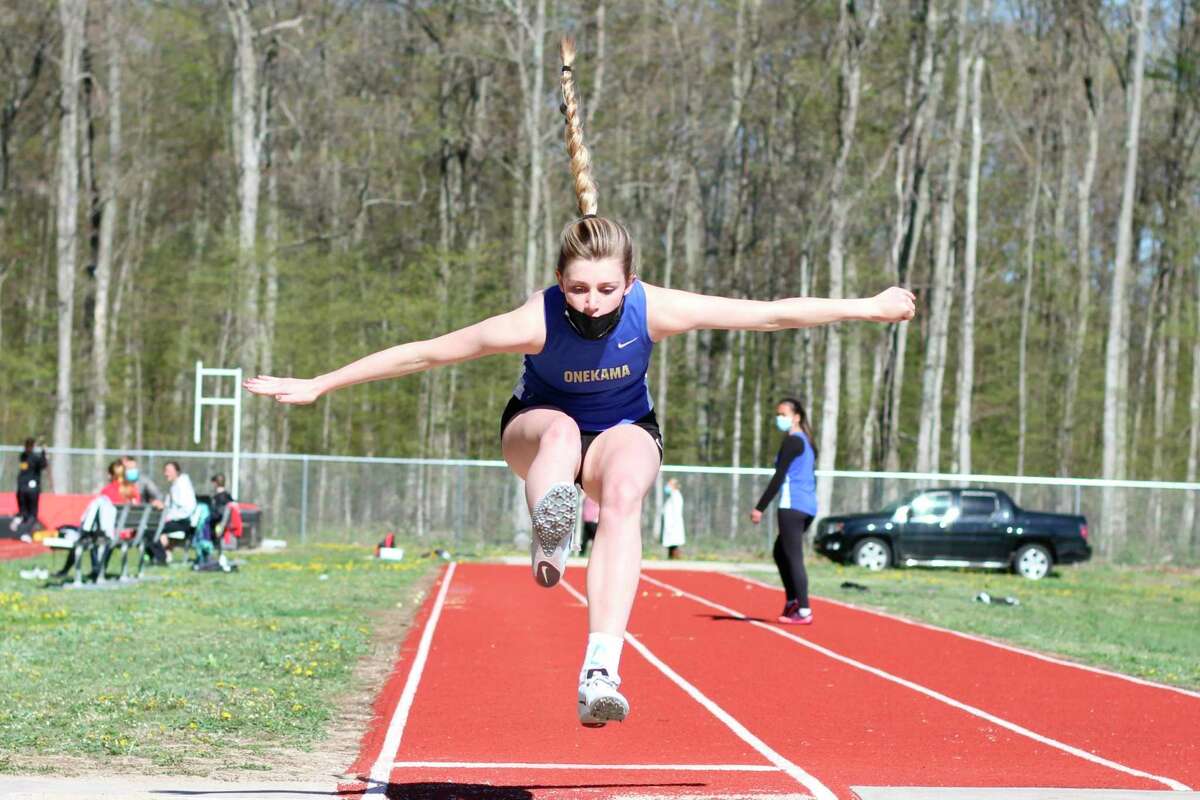 Mairin McCarthy competes in the long jump for Onekama on May 5, 2021. 