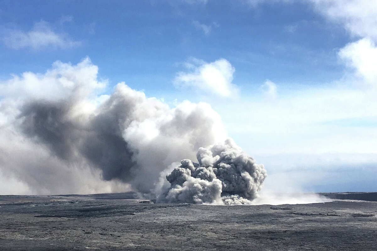  An ash plume rises from Kilauea in Hawaii on May 23, 2018. Lava from the volcano reached the coast of the Pacific Ocean, shooting up dramatic plumes of toxic steam as the extremely hot lava evaporated the cool water.