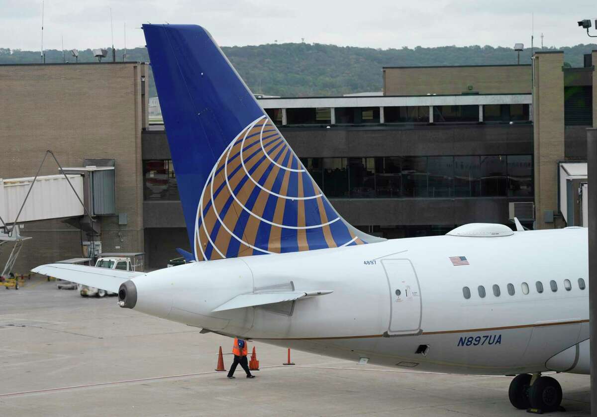 FILE - Company logo adorns the tail of a United Airlines jetliner being prepared for departure at Eppley Airfield on Oct. 6, 2021, in Omaha, Neb.