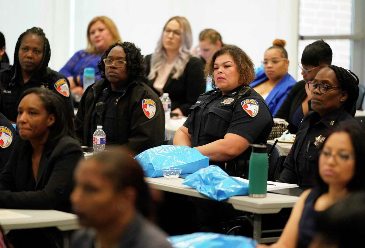 People attend a human trafficking presentation by Sydney Zuiker, safe community program director, at Crime Stoppers, 3001 Main St., Thursday, March 17, 2022, in Houston.