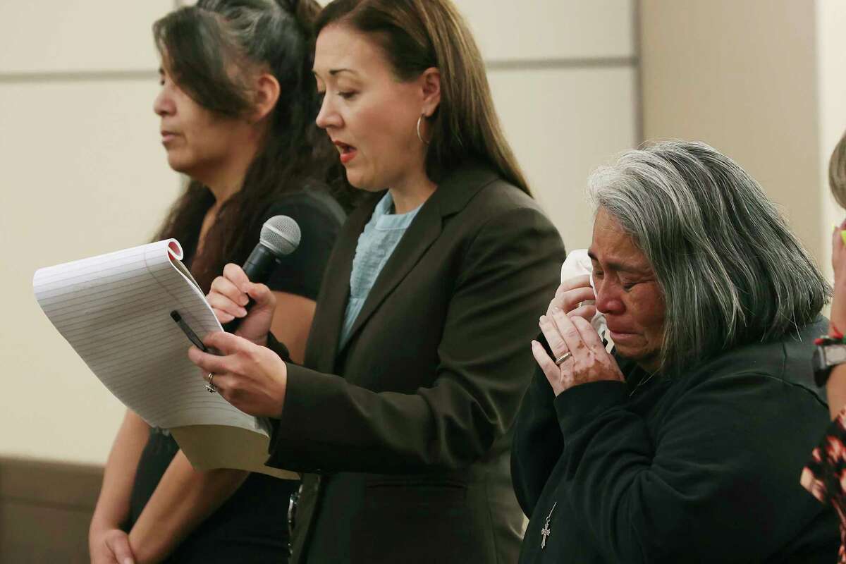 Cynthia Hernandez, right, reacts as prosecutor Gretchen Flader, center, reads a victim impact statement after Jonathan Johnson pleaded guilty to murder on Thursday.
