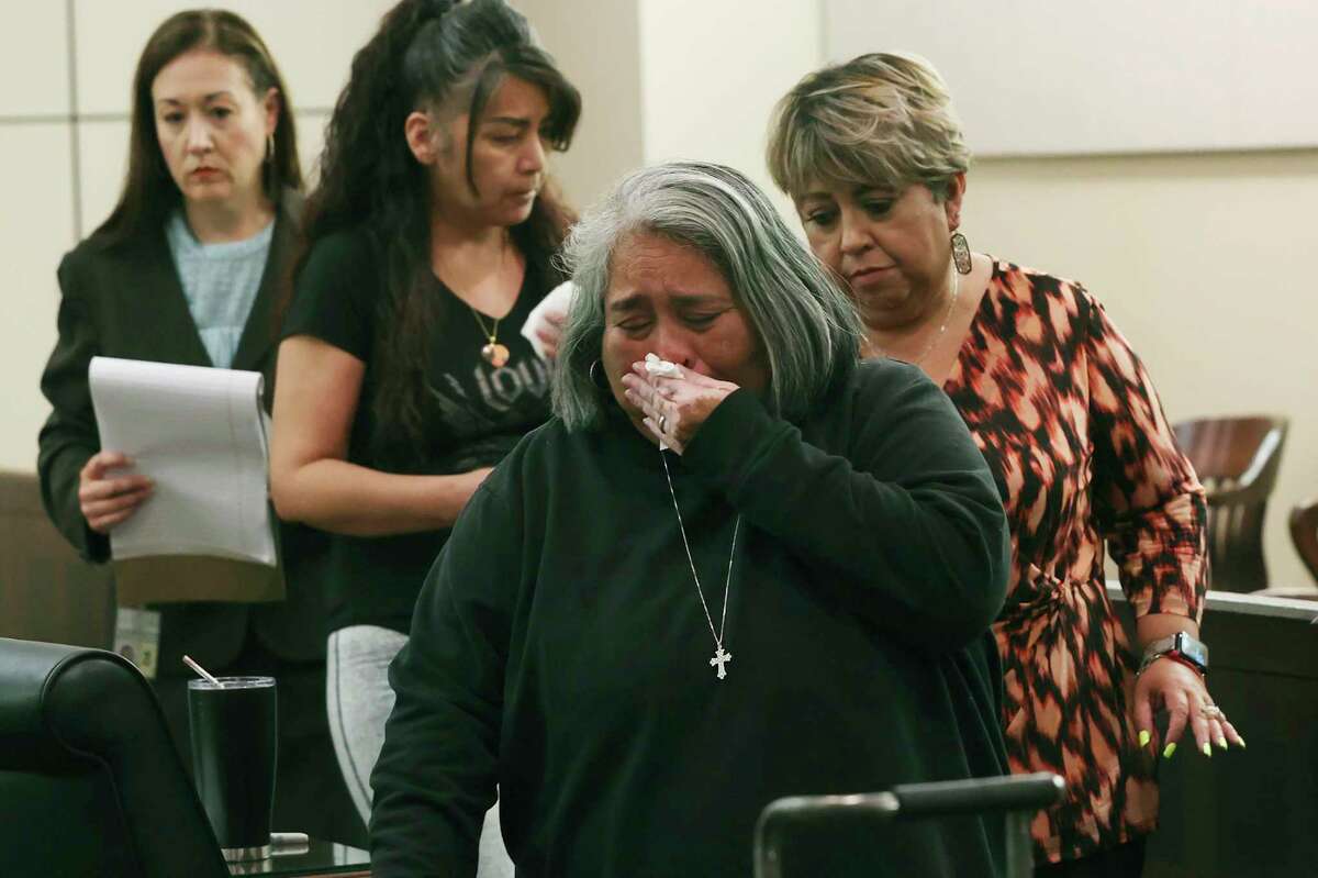 Cynthia Hernandez, front center, and Christina Casarez, second from left, leave the courtroom on Thursday after their victim impact statements in the sentencing of Jonathan Johnson, who pleaded guilty to murder in the fatal shooting of Hernandez’ son, Andres Luis Rangel, 19; and Casarez’s daughter, Katrina Marie Casarez, 18.