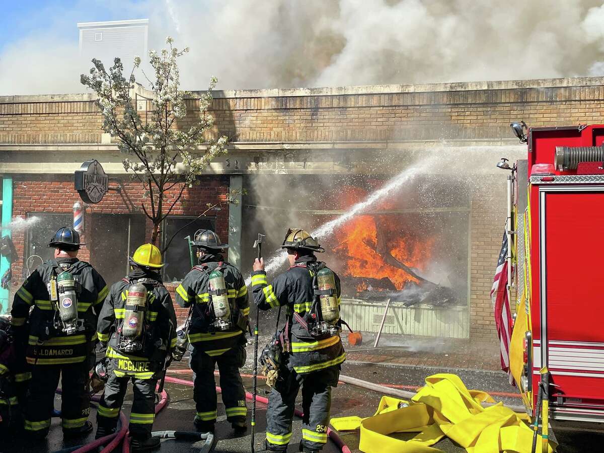 Units battled a blaze on Main Street in Seymour, Conn., on Wednesday, April 20, 2022. Fire officials said the building was deemed a total loss after the blaze, which took about five hours to fully extinguish.