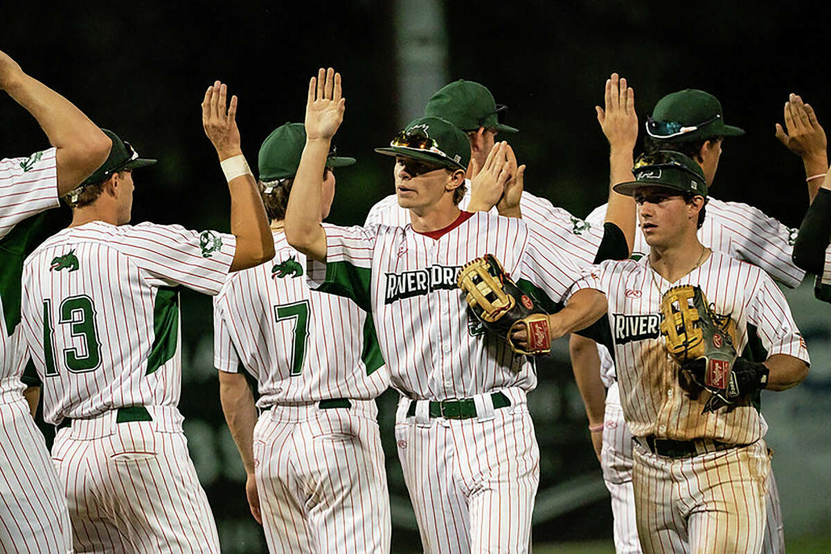 Alton River Dragons players celebrate a victory last season at Lloyd Hopkins Field. The River Dragons' 2022 season opener is set for June 1 at Hopkins Field against Springfield.