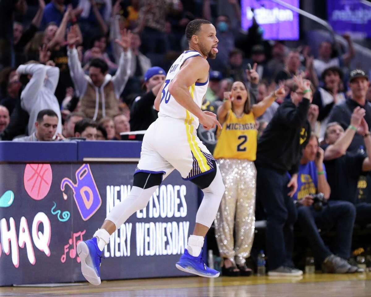 Golden State Warriors’ Stephen Curry reacts to his 3-pointer against Denver Nuggets in Game 2 of NBA Western Conference 1st round playoff series at Chase Center in San Francisco, Calif, on Monday, April 18, 2022.