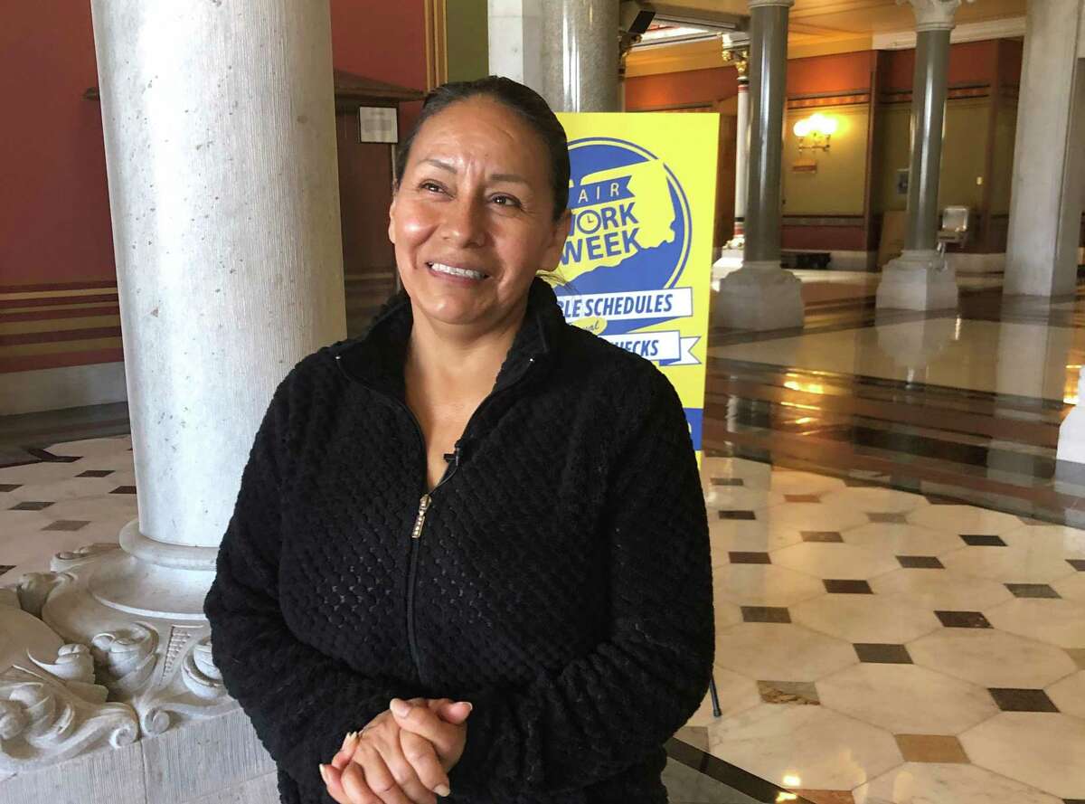 Elva Salazar stands in the Connecticut State Capitol in Hartford during a visit in support of the Fair Work Week bill on Tuesday, April 12, 2022.