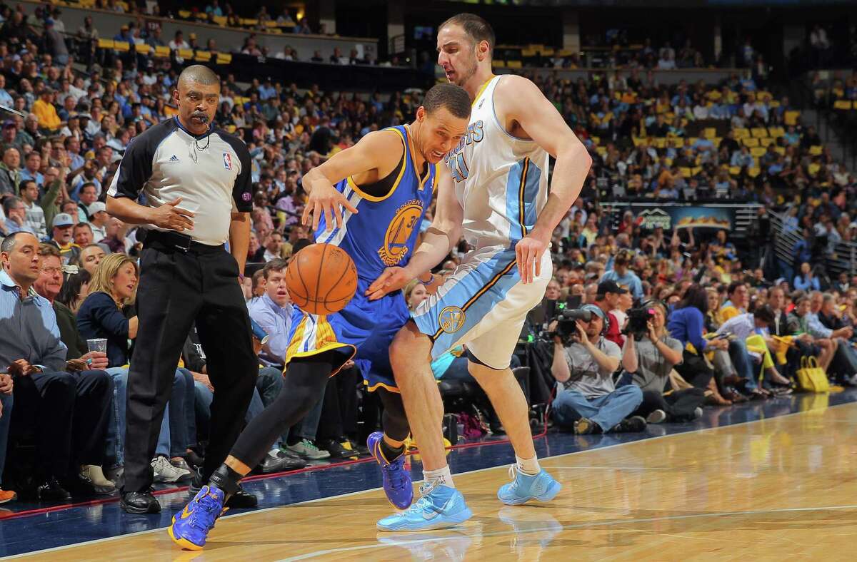 Warriors guard Stephen Curry is fouled by the Nuggets’ Kosta Koufos in Game 5 of their 2013 series. Thursday night marks the Warriors’ first playoff game in Denver since that night.