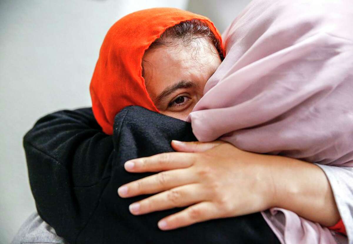 Arian Royeen embraces her mother, Gul Makai Royeen, at San Francisco International Airport.