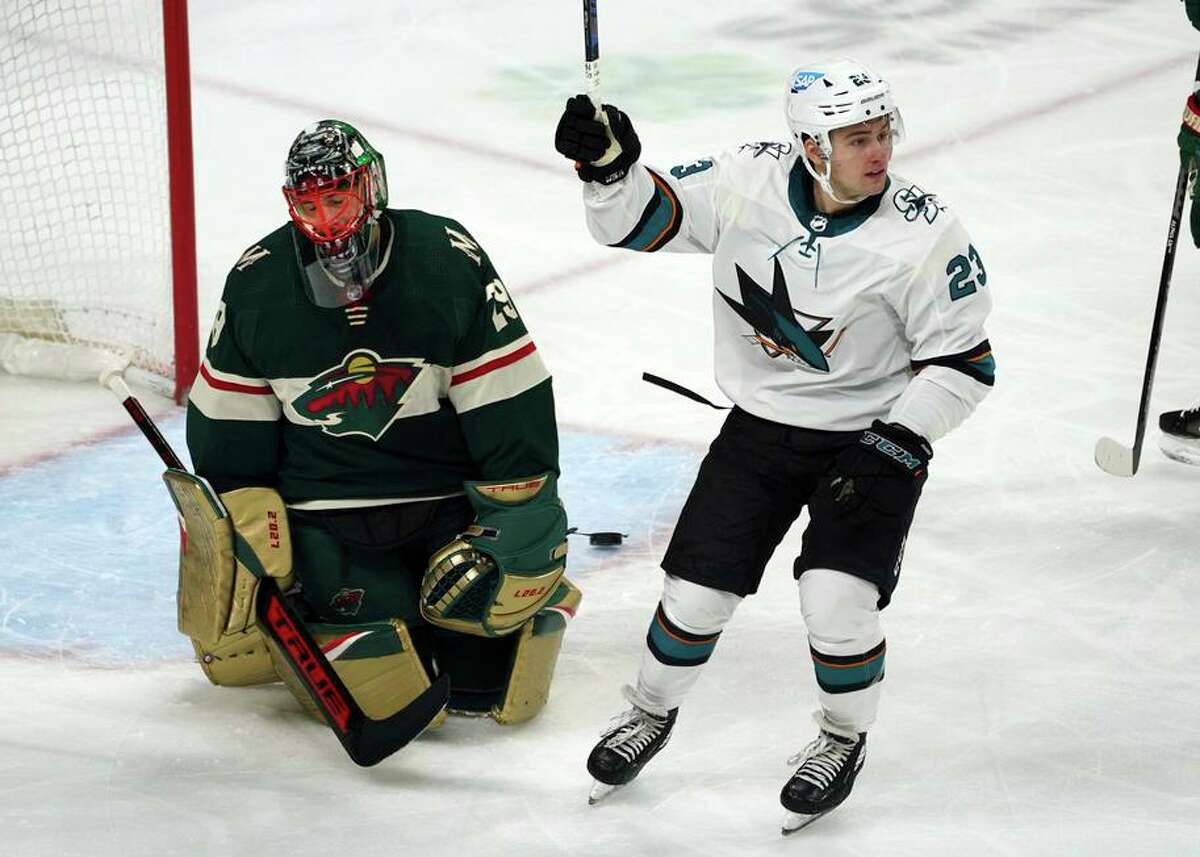 Sharks rookie forward Thomas Bordeleau celebrates a goal by teammate Rudolfs Balcers in an April 17 loss to the Wild.
