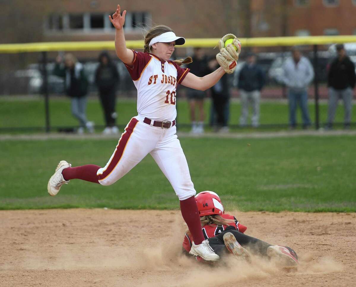 Masuk's Natalie Lieto steals second base as St. Joseph's Niamh Dougherty grabs a high throw during their girls softball game at St. Joseph High School in Trumbull, Conn., on Thursday, April 21, 2022.