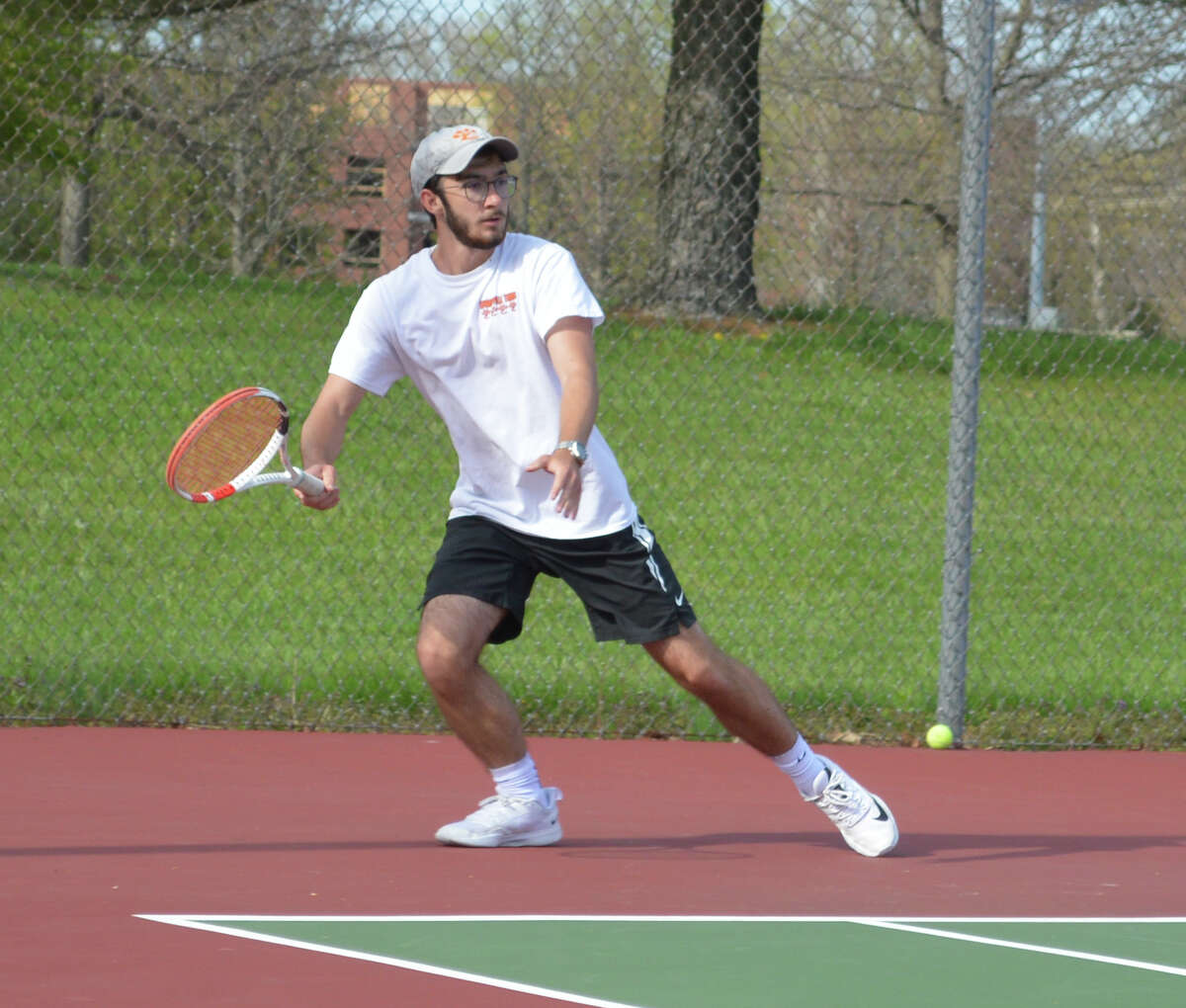 Jake Summers in action against Collinsville on Thursday at the Edwardsville Tennis Center.