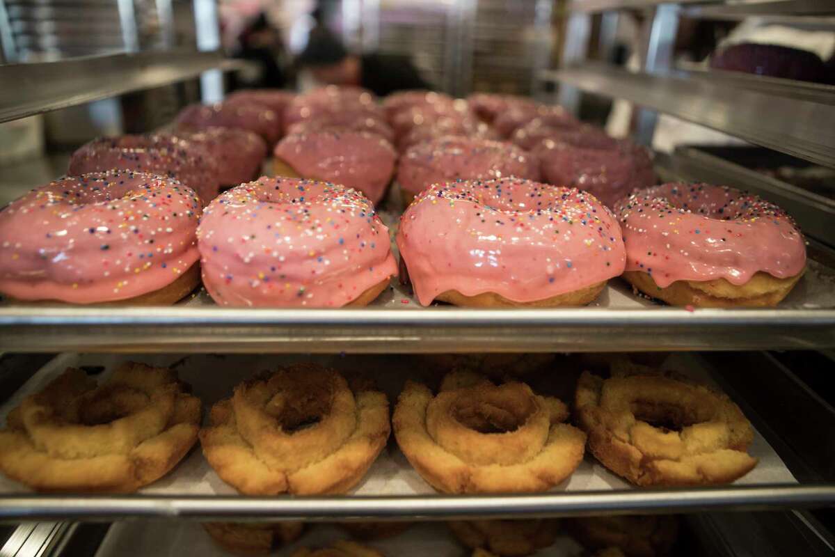 The Homer doughnuts and the Old Fashioned doughnuts are shown on a rack at Voodoo Doughnut on Tuesday, Jan. 7, 2020, in Houston. Voodoo Doughnut has opened its fourth Houston-area location in Katy.