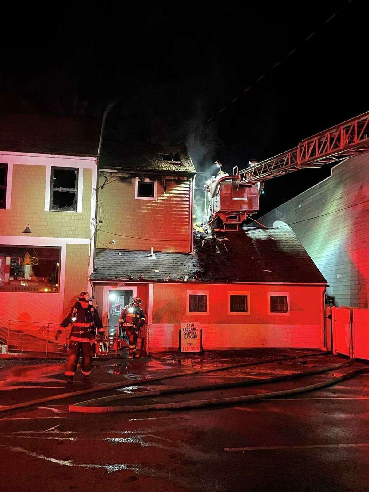 Fire officials said a late-night fire on Post Road East in Westport, Conn., prompted occupants of a second-floor apartment to jump from a window to escape. Officials said about 50 cats and dogs were rescued from a boarding facility that was housed on the first floor and in the basement of the establishment.
