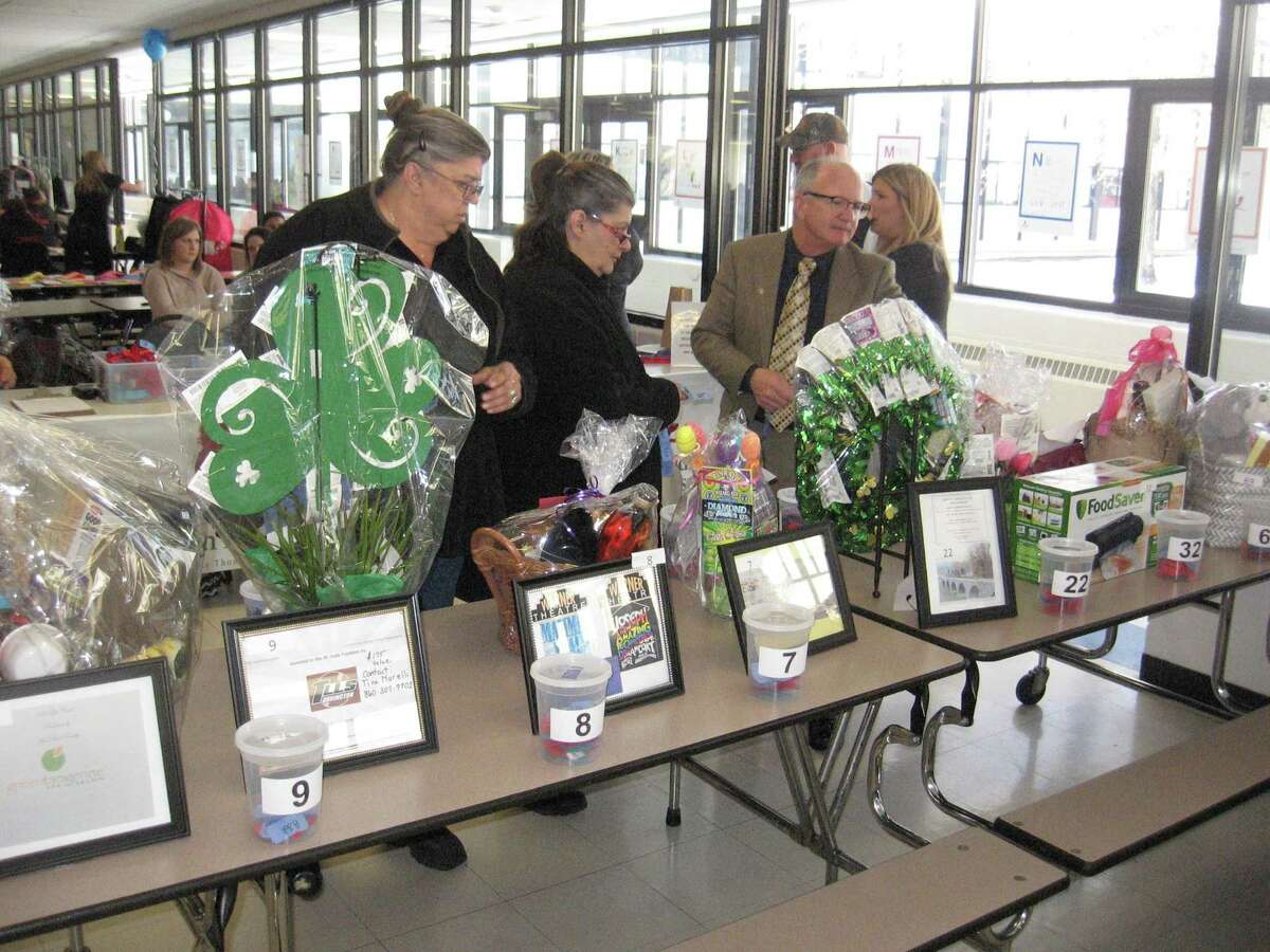 The Tim Driscoll St. Jude Children's Research Hospital Telethon returns to Torrington High School May 1. In the photo, guests look over a selection of gift baskets during the 2019 event.