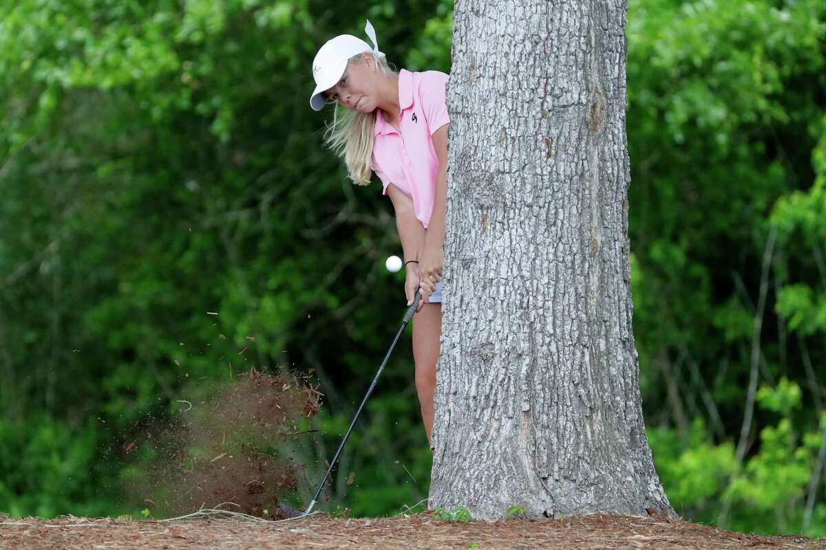 Melanie Maier of George Ranch hits around a tree off the 16th fairway during the second round of the Region III-6A Girls Golf Tournament held at Eagle Pointe Golf ClubTuesday, Apr. 19, 2022 in Mont Belvieu, TX.